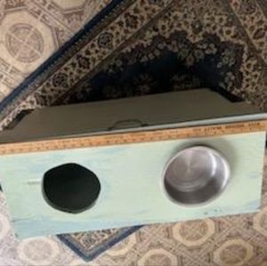 Large dog food station and bin storage.